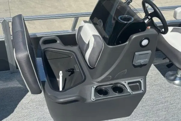 Slide: The Image of 2026 Sun Tracker Bass Buggy 16 XL Select console with steering wheel and cup holders. - 13