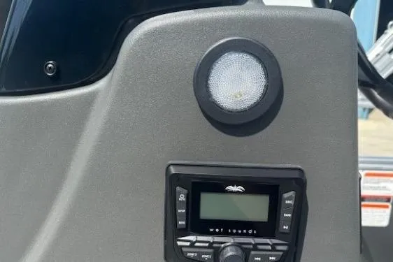 Slide: The Image of Control panel of 2026 Sun Tracker Bass Buggy 16 XL Select with speaker and display. - 15
