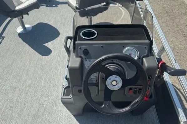Slide: The Image of Steering console of 2026 Sun Tracker Bass Buggy 16 XL Select pontoon boat. - 16