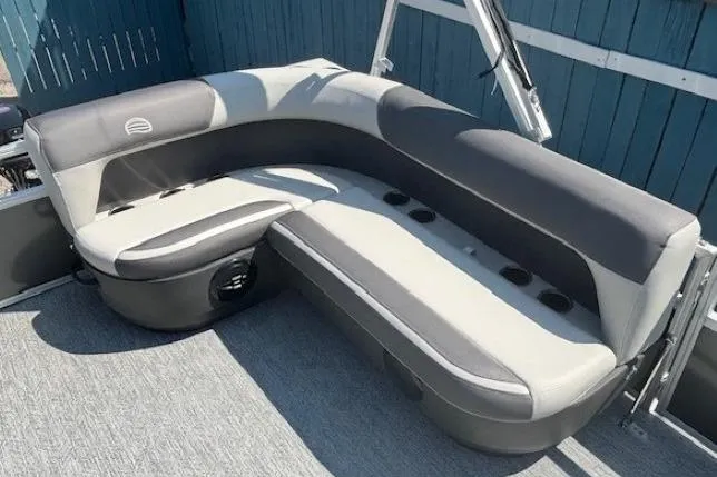 Slide: The Image of 2026 Sun Tracker Bass Buggy 16 XL Select pontoon boat seating, gray and black upholstery. - 18