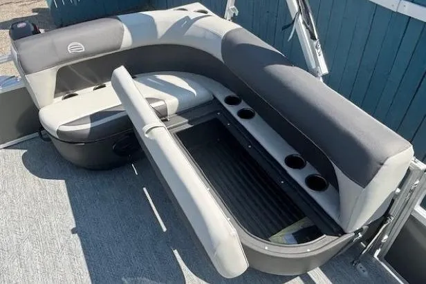 Slide: The Image of 2026 Sun Tracker Bass Buggy 16 XL Select boat seating with storage and cup holders. - 19