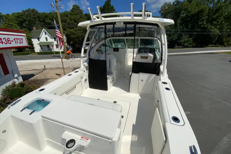 Slide: The Image of 2026 Pursuit DC 266 Dual Console boat with spacious deck and modern design. - 11