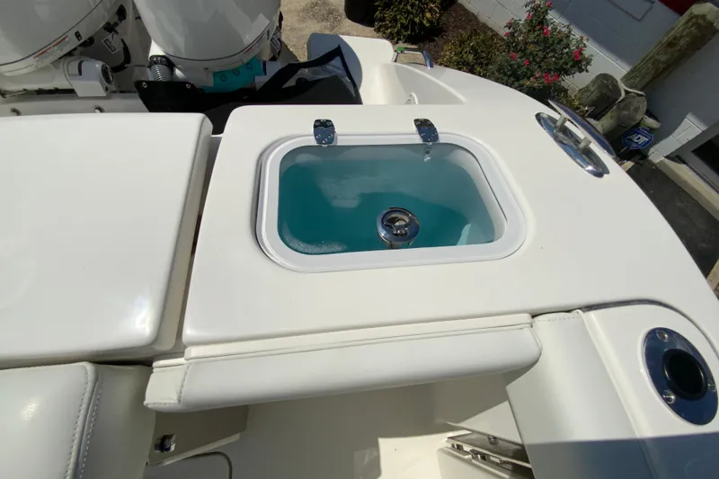 Slide: The Image of 2026 Pursuit DC 266 Dual Console boat with livewell feature, showcasing sleek design and functionality. - 25