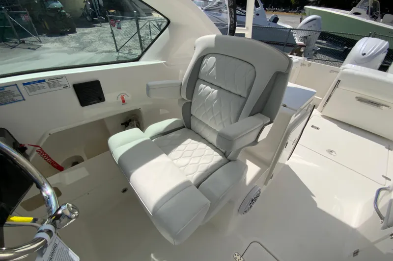 Slide: The Image of 2026 Pursuit DC 266 Dual Console boat with luxurious seating and modern design. - 30