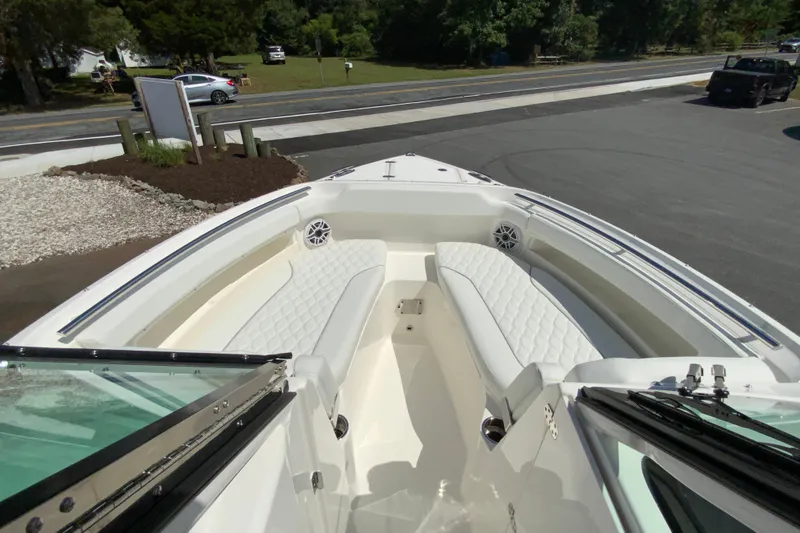 Slide: The Image of 2026 Pursuit DC 266 Dual Console boat with spacious seating and sleek design. - 36