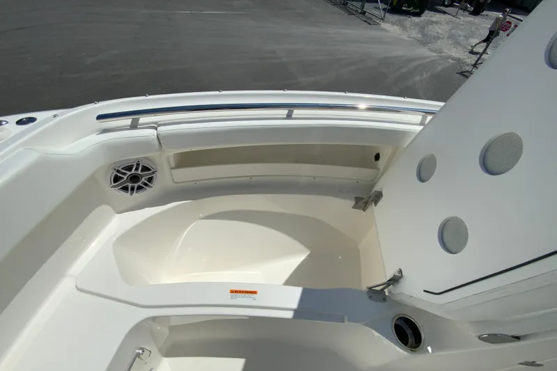 Slide: The Image of 2026 Pursuit DC 266 Dual Console boat interior with seating and storage compartments. - 38
