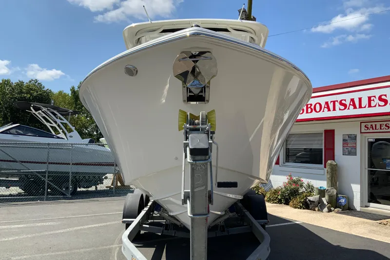 Slide: The Image of 2026 Pursuit DC 266 Dual Console boat on trailer at sales lot. - 5