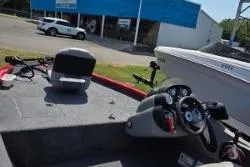 Slide: The Image of 2017 Bass Tracker Pro Team 175 boat interior with steering console and seating. - 10