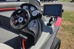 Slide: The Image of 2017 Bass Tracker Pro Team 175 dashboard with steering wheel and electronic display. - 4