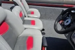 Slide: The Image of 2017 Bass Tracker Pro Team 175 boat interior with gray and red seats. - 5
