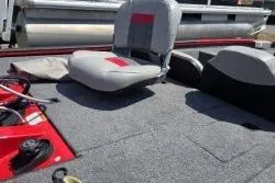 Slide: The Image of 2017 Bass Tracker Pro Team 175 boat interior with seating and storage compartments. - 6