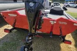 Slide: The Image of 2017 Bass Tracker Pro Team 175 boat, red exterior, parked on grass. - 8