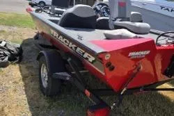 Slide: The Image of 2017 Bass Tracker Pro Team 175 boat on trailer, red and gray design. - 9