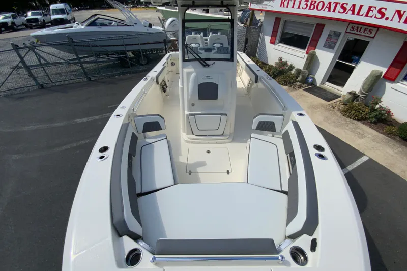 Slide: The Image of 2026 Cobia 265 Open Center Console boat with spacious seating and modern design. - 30
