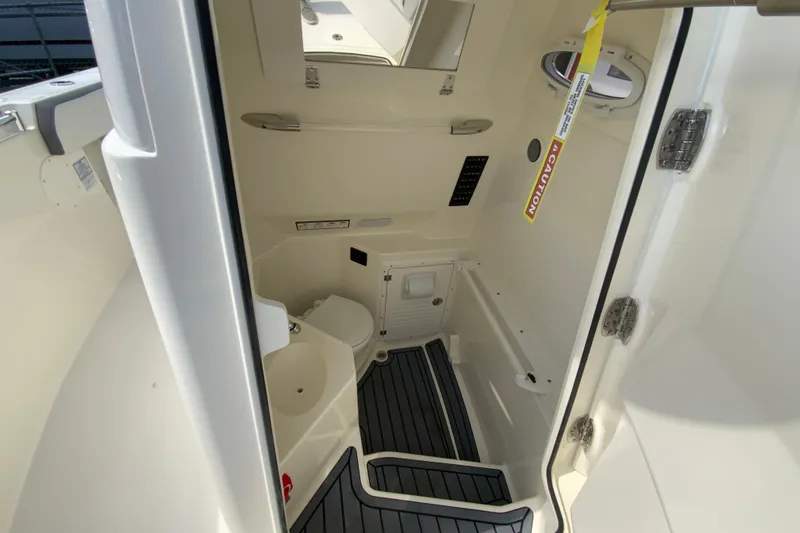 Slide: The Image of 2026 Cobia 265 Open Center Console interior with modern amenities and sleek design. - 34