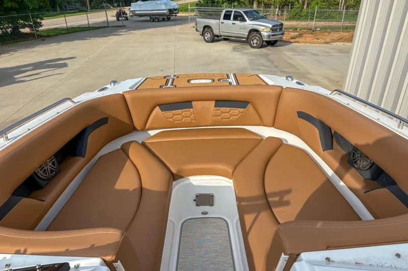 Slide: The Image of 2022 Four Winns HD5 boat interior with tan leather seating and modern design. - 3