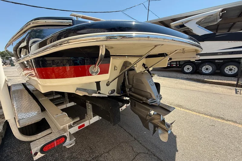 Slide: The Image of 2019 Chris-Craft Corsair 27 boat on trailer, rear view showing propeller and hull design. - 4