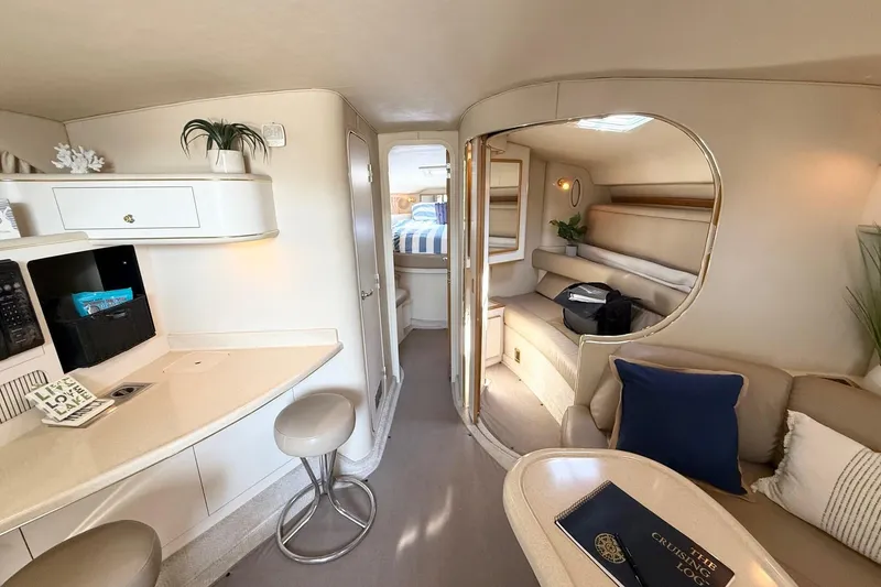 Slide: The Image of Luxurious interior of a 1998 Sea Ray 400 Express Cruiser yacht, featuring elegant seating and decor. - 15