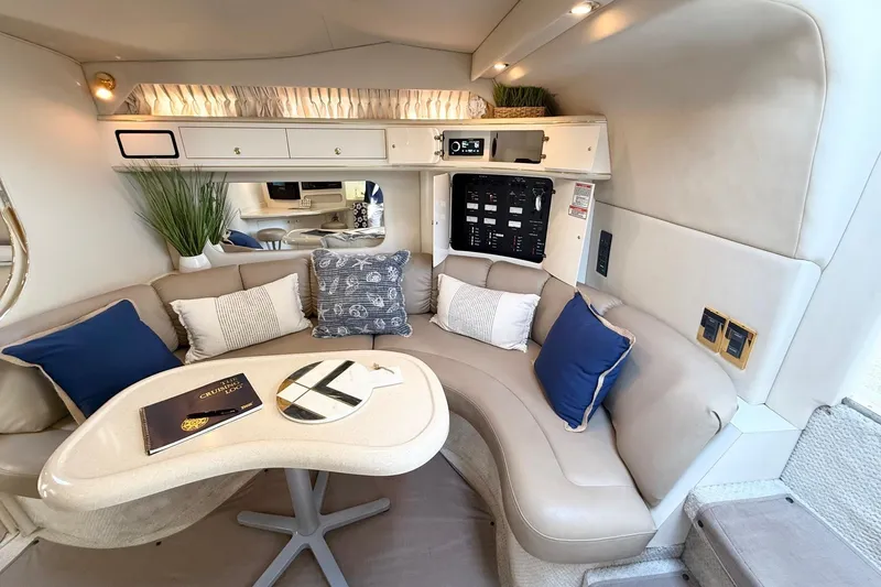 Slide: The Image of Luxurious interior of 1998 Sea Ray 400 Express Cruiser with plush seating and elegant decor. - 16