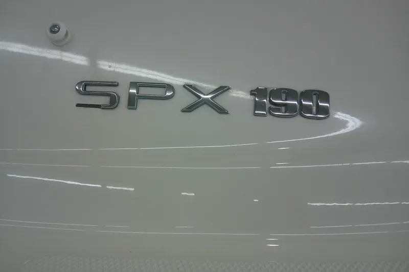 Slide: The Image of 2018 Sea Ray SPX 190 logo on boat exterior, showcasing sleek design. - 10