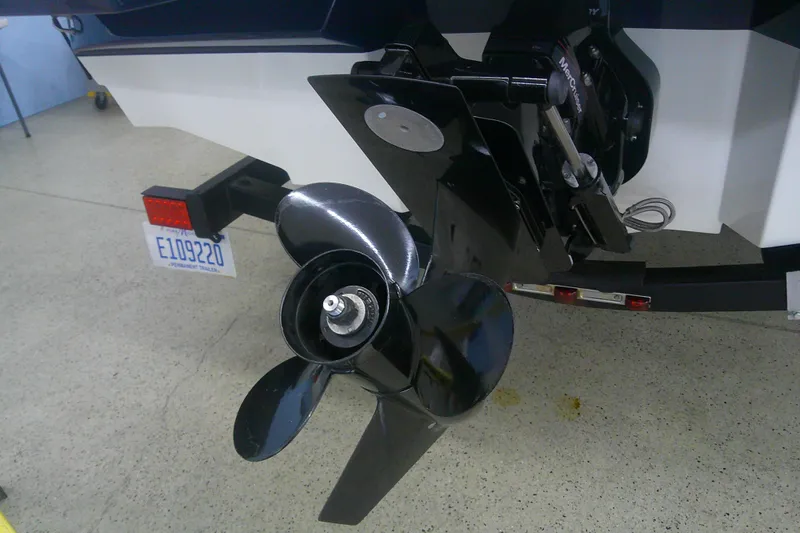 Slide: The Image of 2018 Sea Ray SPX 190 boat propeller and outdrive on display in a showroom. - 11