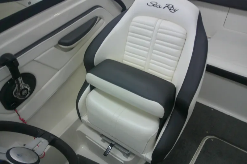 Slide: The Image of 2018 Sea Ray SPX 190 boat seat, white and black upholstery, sleek design. - 6