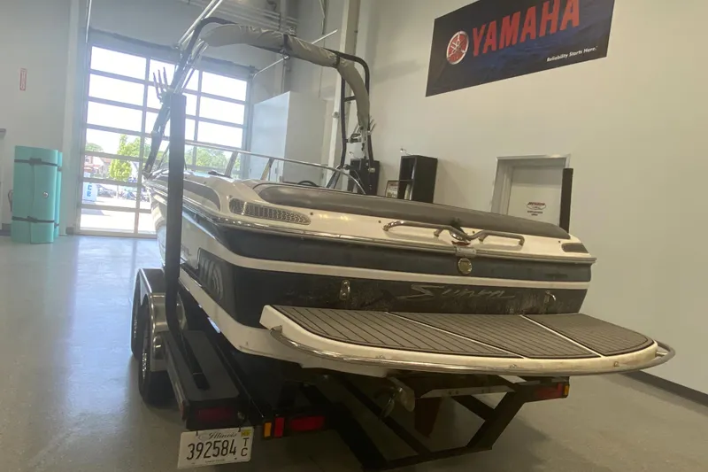 Slide: The Image of 2002 Supra Sunsport 22' boat on trailer in indoor showroom. - 5