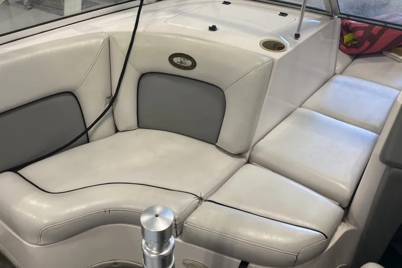 Slide: The Image of 2002 Supra Sunsport 22' boat interior with white and gray seating. - 7