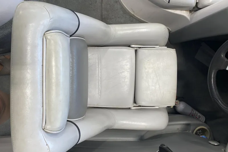 Slide: The Image of 2002 Supra Sunsport 22' boat interior with white leather seating and steering wheel. - 8