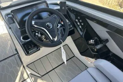 Slide: The Image of 2025 Yamaha Boats 255XD cockpit with modern steering and control panel. - 5