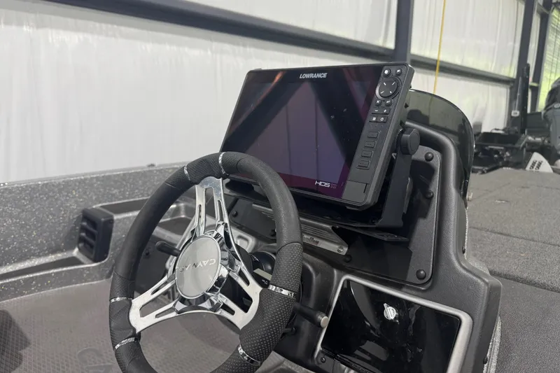 Slide: The Image of 2022 Caymas CX 21 PRO boat dashboard with Lowrance HDS display and steering wheel. - 10