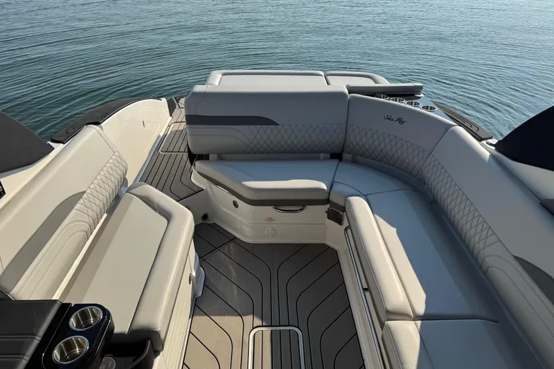 Slide: The Image of Luxurious interior of 2024 Sea Ray SLX 280 boat with elegant seating and cup holders. - 11