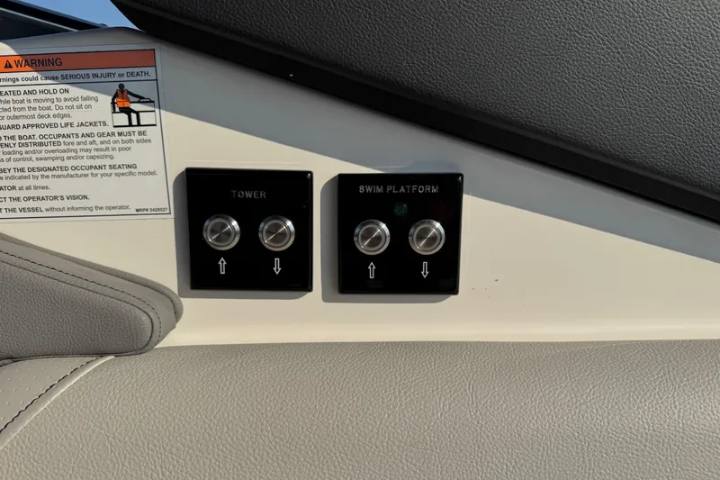 Slide: The Image of Control panel on 2024 Sea Ray SLX 280 boat, featuring tower and swim platform buttons. - 16