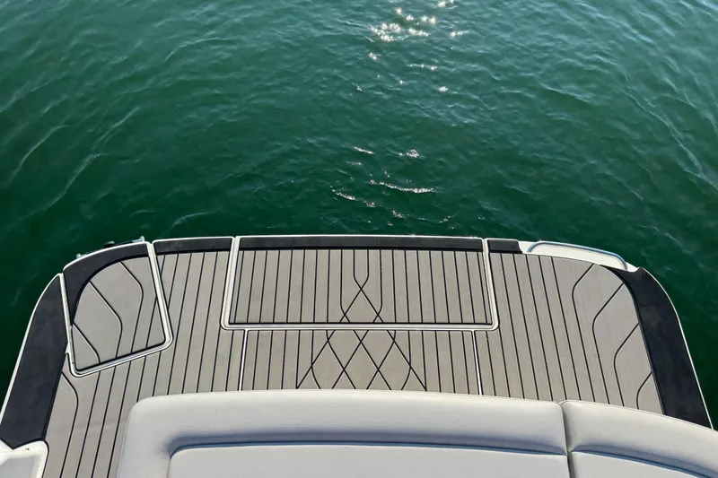 Slide: The Image of 2024 Sea Ray SLX 280 boat deck overlooking calm water. - 20