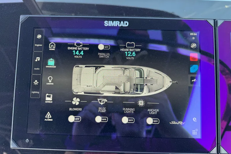 Slide: The Image of Simrad display on 2024 Sea Ray SLX 280 showing battery and system controls. - 25