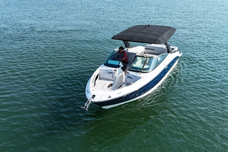 Slide: The Image of 2024 Sea Ray SLX 280 boat cruising on open water, featuring sleek design and spacious seating. - 4