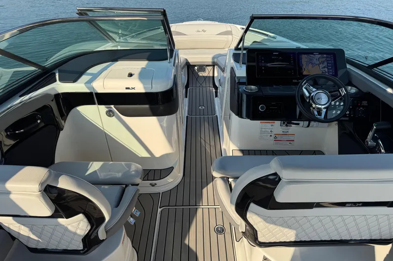 Slide: The Image of 2024 Sea Ray SLX 280 boat interior with modern dashboard and luxurious seating. - 7