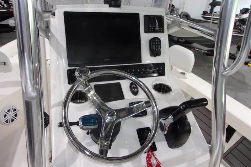 Slide: The Image of 2024 Pathfinder 2200 boat console with steering wheel and navigation controls. - 11