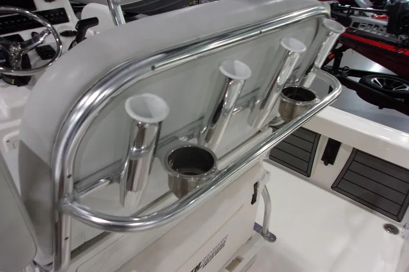 Slide: The Image of 2024 Pathfinder 2200 boat console with rod holders and cup holders. - 12