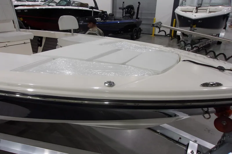 Slide: The Image of 2024 Pathfinder 2200 boat on display in showroom, featuring sleek design and modern amenities. - 20