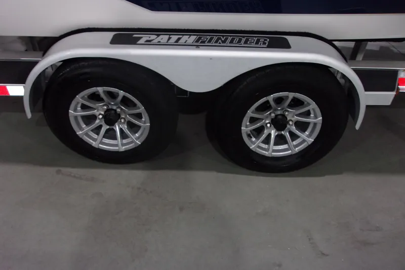 Slide: The Image of 2024 Pathfinder 2200 trailer wheels with sleek silver rims. - 22