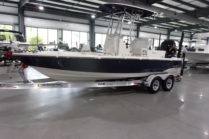 Slide: The Image of 2024 Pathfinder 2200 boat on trailer in showroom, side view. - 3