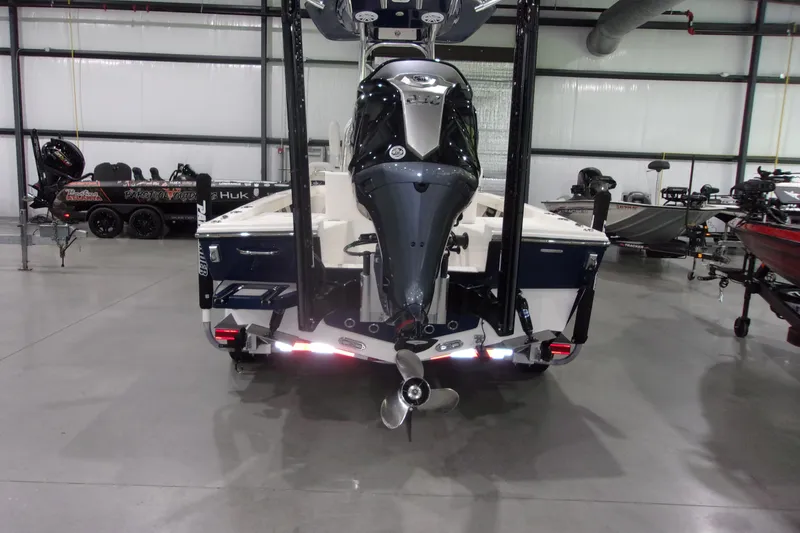 Slide: The Image of 2024 Pathfinder 2200 boat in showroom, rear view with motor and propeller. - 5