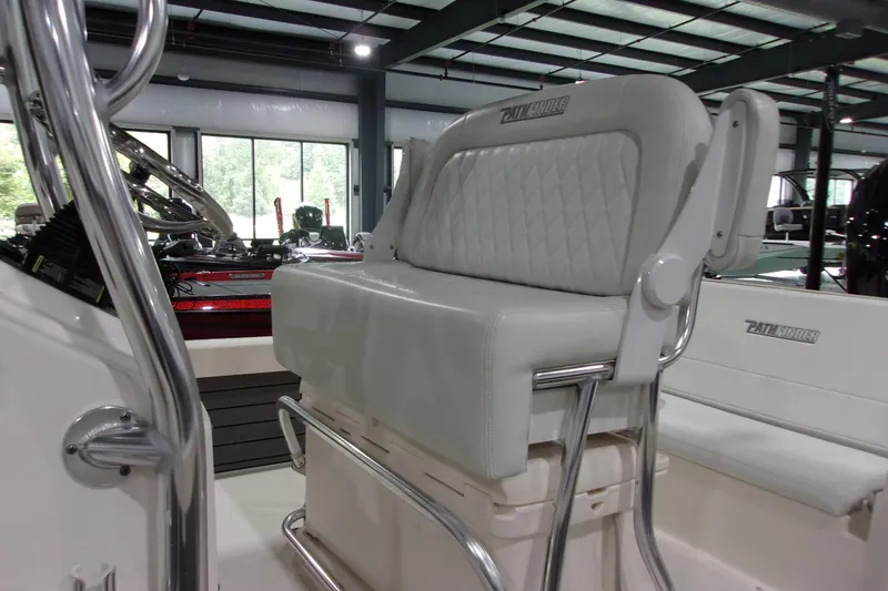 Slide: The Image of 2024 Pathfinder 2200 boat interior with cushioned seating and stainless steel frame. - 7