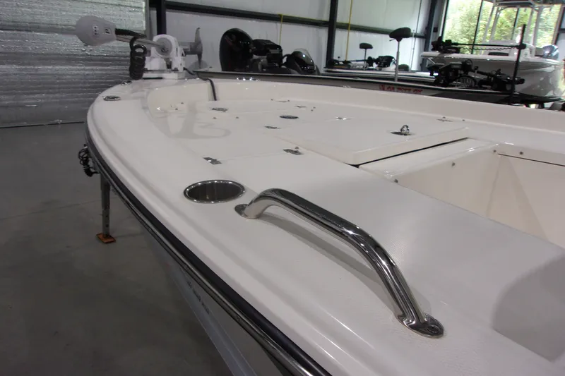 Slide: The Image of 2024 Pathfinder 2200 boat interior with stainless steel fittings in a showroom. - 8