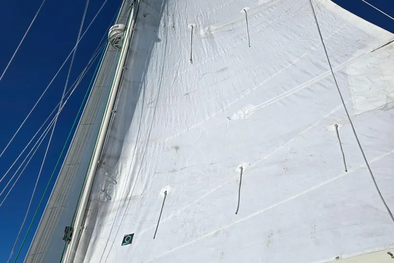 Slide: The Image of Close-up of a 1985 Pacific Seacraft 37 sail against a clear blue sky. - 17
