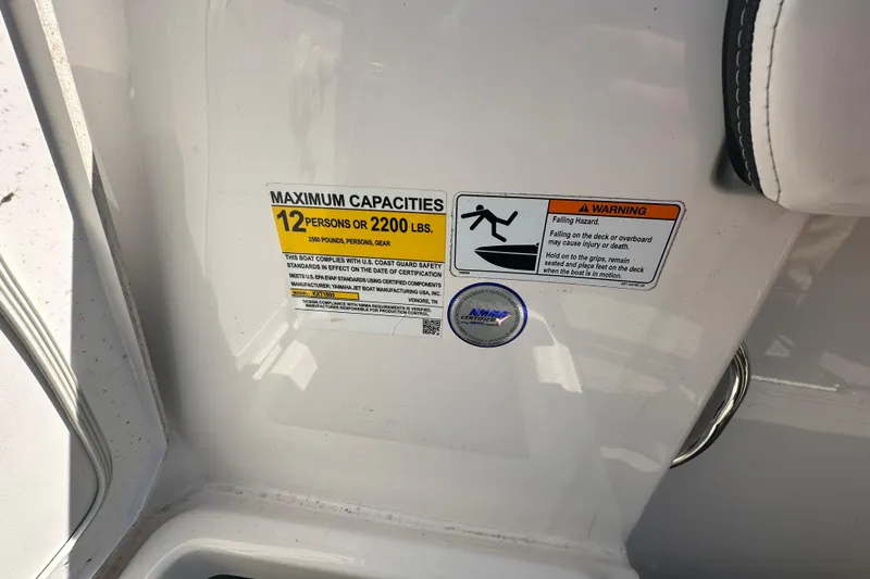 Slide: The Image of 2023 Yamaha Boats 252 FSH Sport capacity warning label, maximum 12 persons or 2200 lbs. - 17