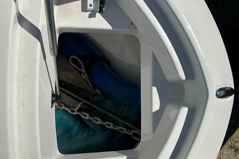 Slide: The Image of Anchor storage compartment on 2023 Yamaha Boats 252 FSH Sport. - 36