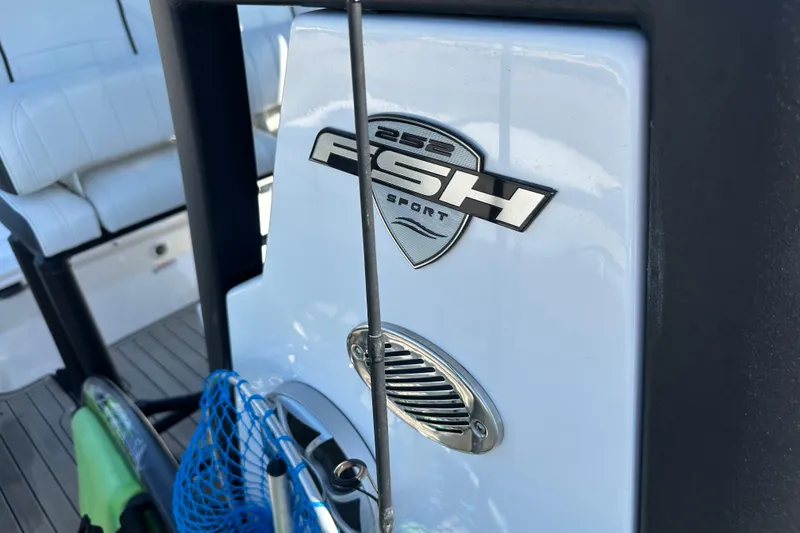 Slide: The Image of 2023 Yamaha Boats 252 FSH Sport logo on boat interior with fishing gear. - 41