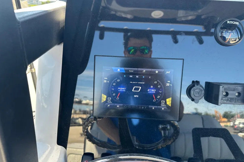 Slide: The Image of Dashboard of 2023 Yamaha Boats 252 FSH Sport with digital display and controls. - 44